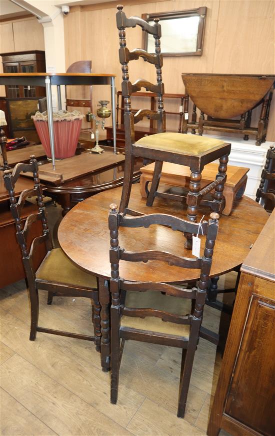 An oak gateleg table and five ladder back chairs W.152cm